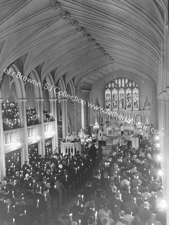 MISSION SCENE CANDLE -LIT SCENE INTERIOR FR.T.COUNIHAM S.J. PREACHING